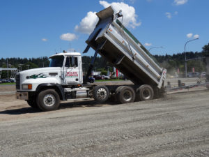 Dump truck pouring gravel
